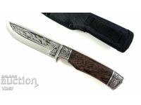 Richly double-sided engraved hunting knife with inlaid wolves