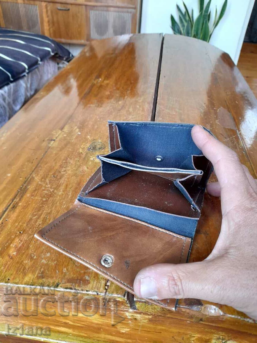 Delivery of An old leather purse Delivery of An old leather purse