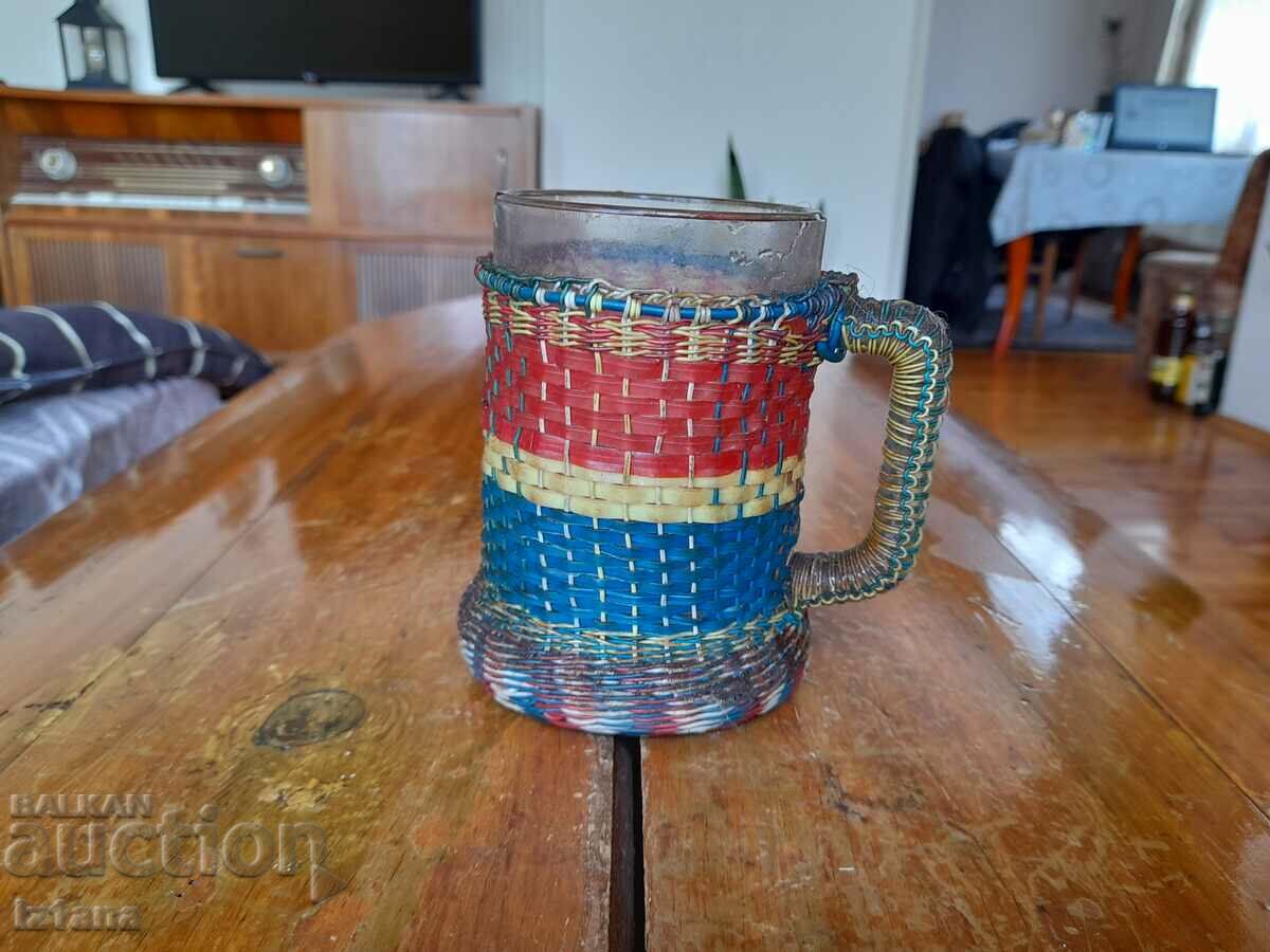 Old wicker mug, glass