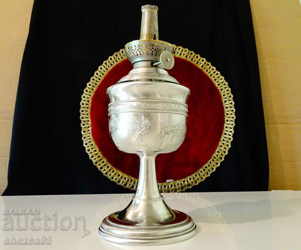 Lampă cu gaz Kosmos Brenner cu pictură Lorelei, cositorită cu preț 199.00 BGN | € 101.75 Lampă cu gaz Kosmos Brenner cu pictură Lorelei, cositorită cu preț 199.00 BGN | € 101.75