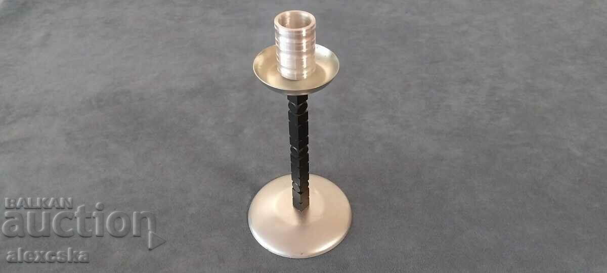 Auction An old metal candleholder Auction An old metal candleholder
