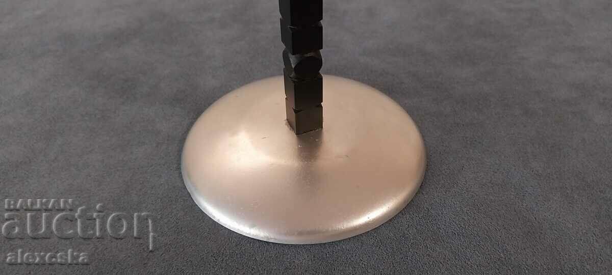 Delivery of An old metal candleholder Delivery of An old metal candleholder