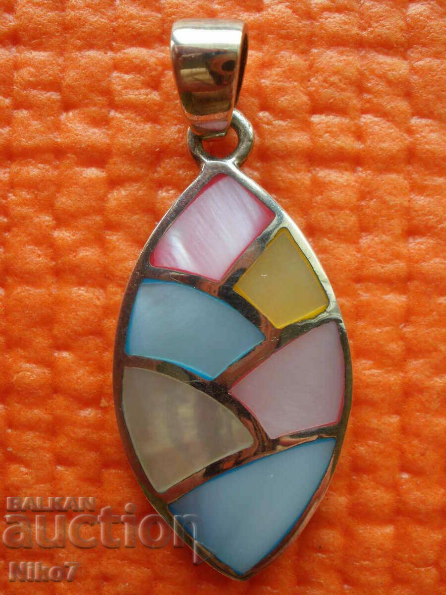 Silver, interesting pendant with mother of pearl.