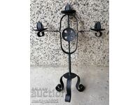 Old forged candlestick, candle, candelabra