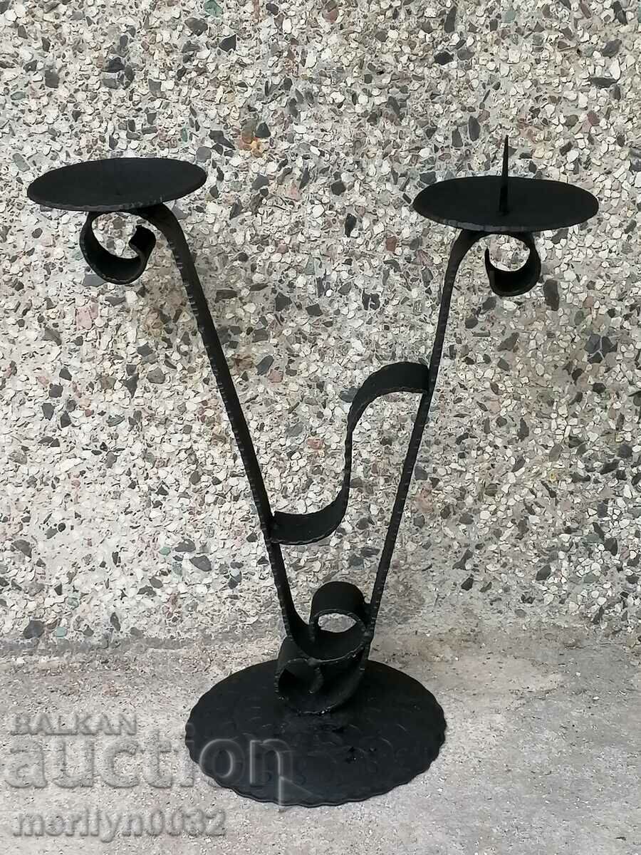 Old forged candlestick, candle, candelabra