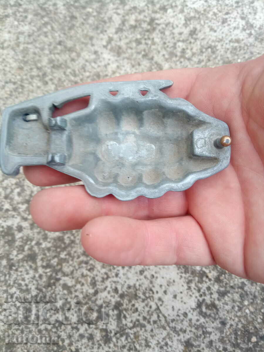 Delivery of Old aluminum buckle in the shape of a grenade Delivery of Old aluminum buckle in the shape of a grenade