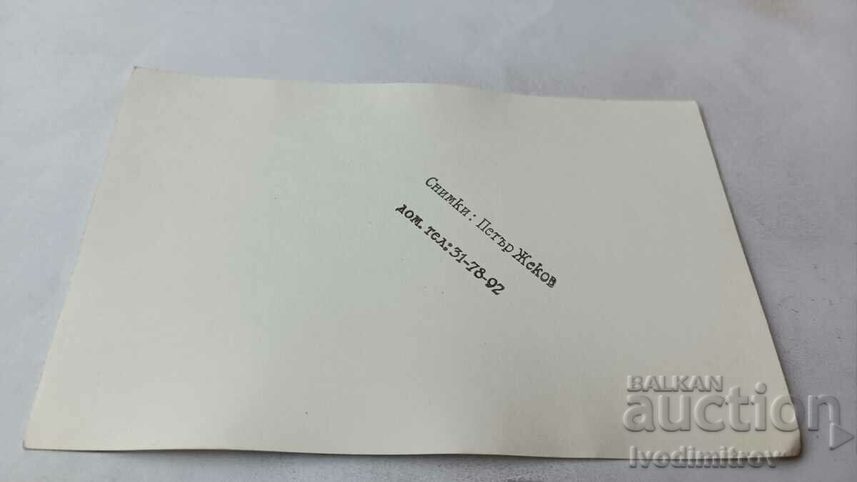 Photo Woman in folk costume in a raging river with price 1.65 BGN | € 0.84