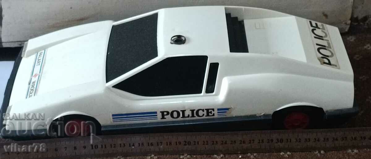 A large plastic police car