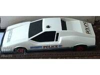 A large plastic police car
