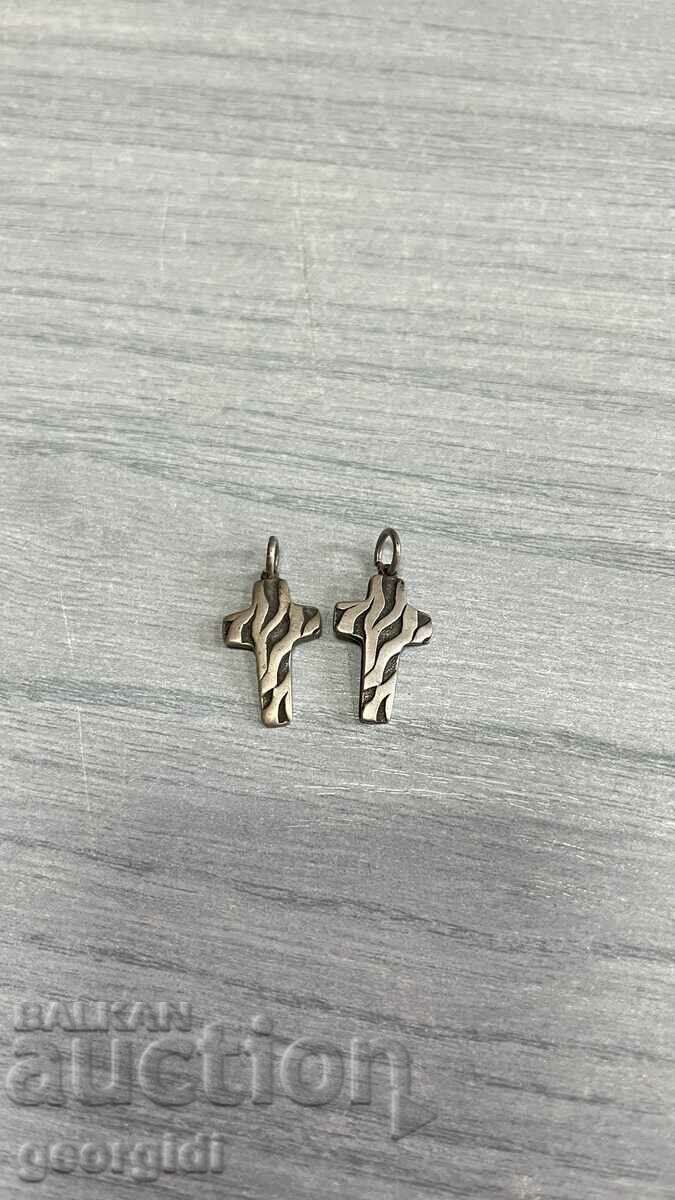 A pair of silver crosses. #4229