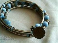 old bracelet made of aesthetic stone cat's eye ses coin