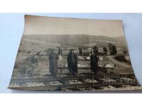 Photo Three soldiers by a railway line