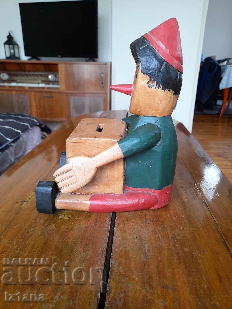 Old wooden Pinocchio piggy bank with price 55.00 BGN | € 28.12 Old wooden Pinocchio piggy bank with price 55.00 BGN | € 28.12