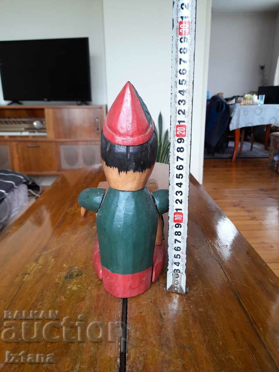 Auction Old wooden Pinocchio piggy bank Auction Old wooden Pinocchio piggy bank