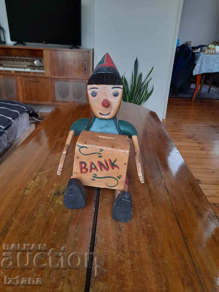 Old wooden Pinocchio piggy bank