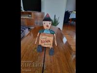 Old wooden Pinocchio piggy bank