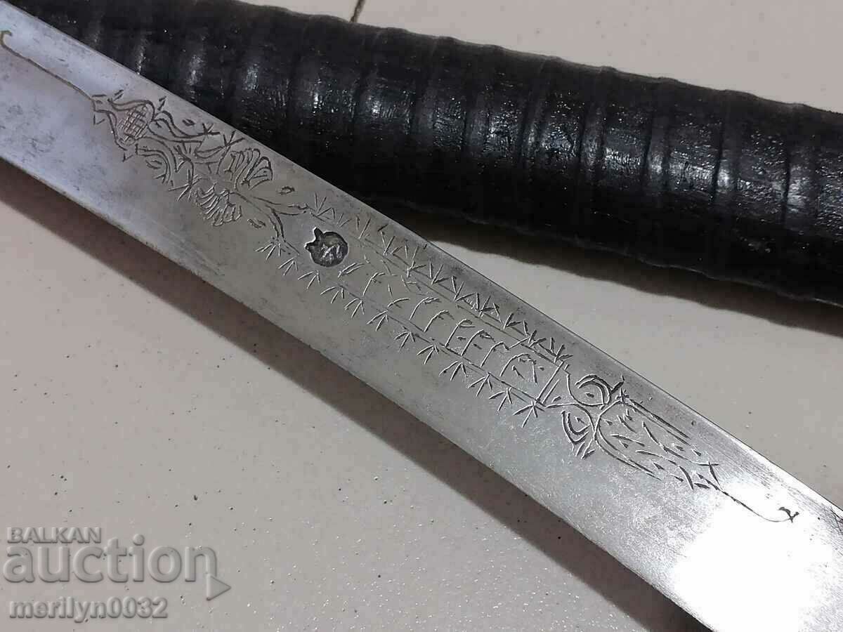 A scimitar with a stamp and engravings with a kaniya karakulak khayduški knife saber