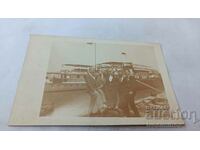 Photo Rousse Five young men in front of a steamer at the port