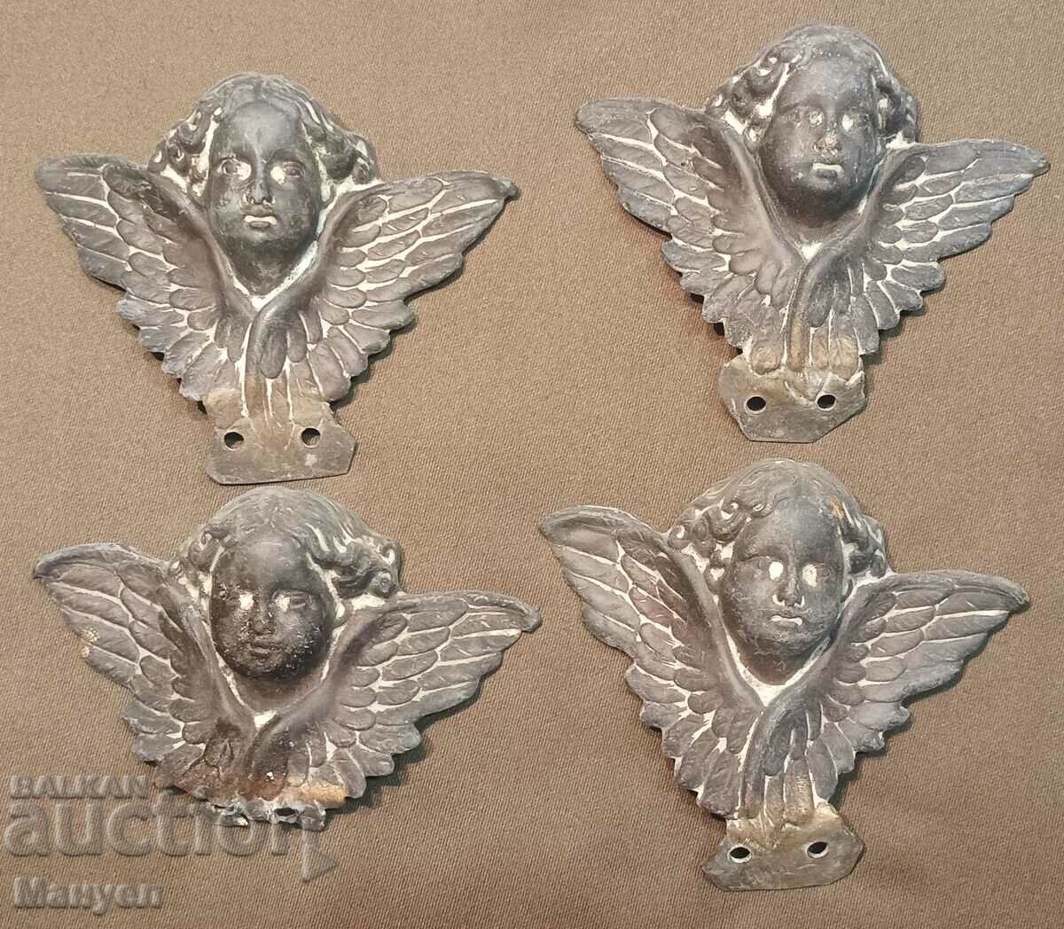 Old brass cherubs 4 pieces.