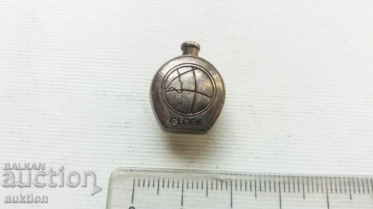 Auction SILVER PLATED GLOBE BADGE Auction SILVER PLATED GLOBE BADGE