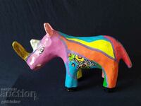 Old figure, colored rhinoceros, papier-mâché