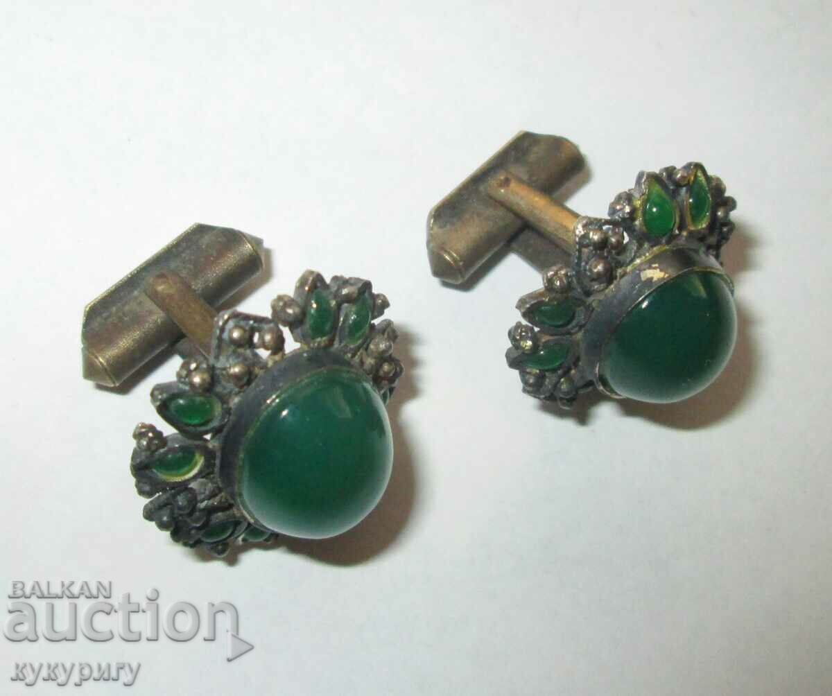Old beautiful cuffs with green stones