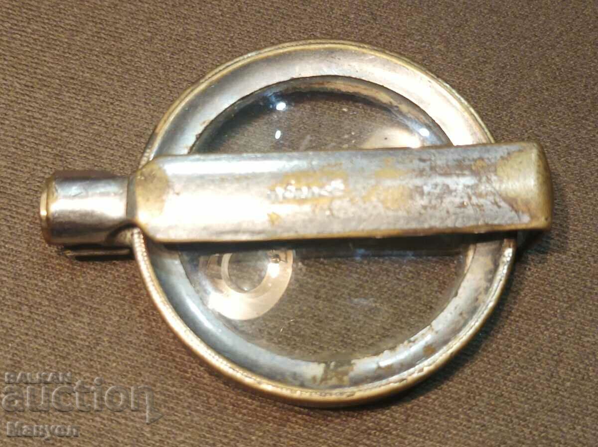 Old folding magnifying glass.