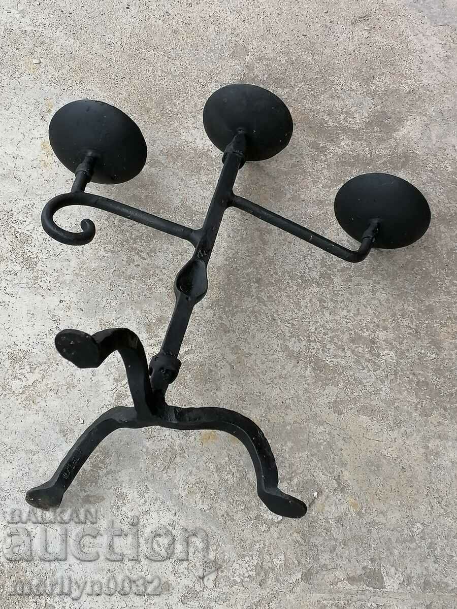 Auction  An old forged candlestick from a period period candle