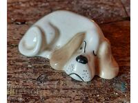 English porcelain figurine of a sleeping dog, marked