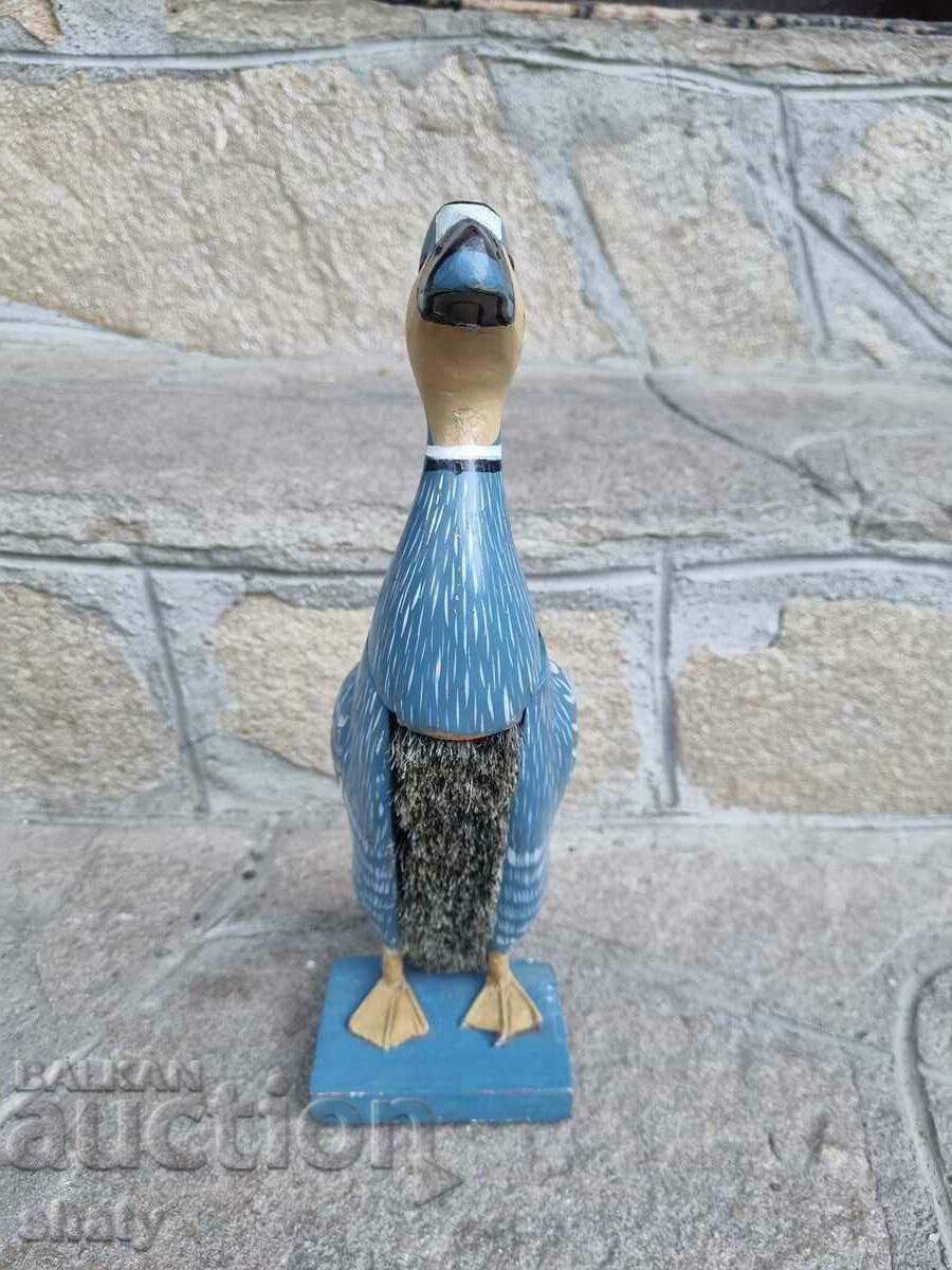 Wooden clothes brush. A duck