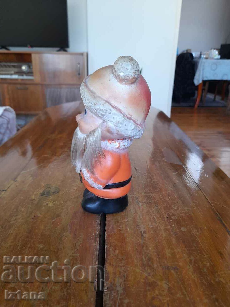 Delivery of Old rubber toy, dwarf