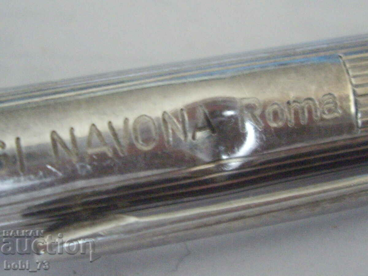 Auction  An old silver pen.