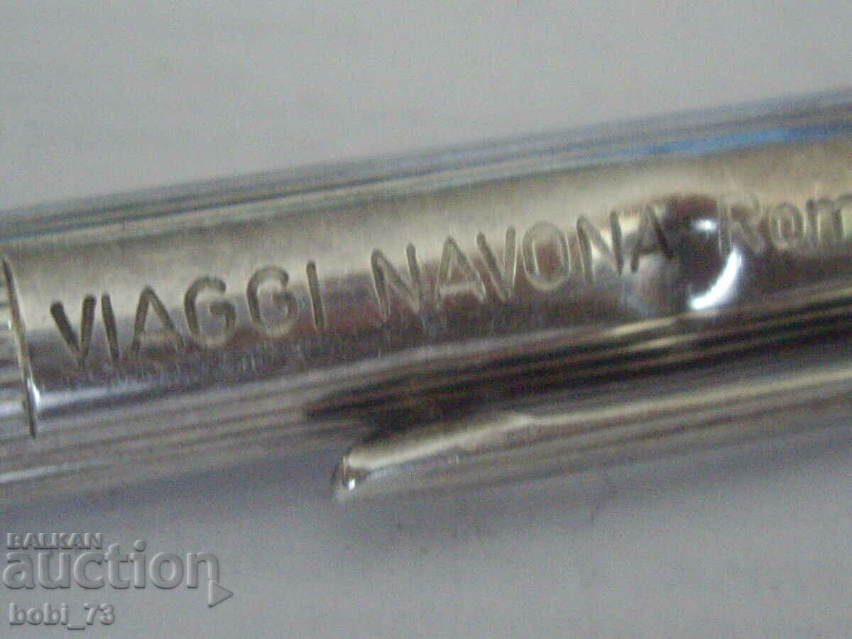 Delivery of An old silver pen.