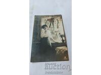 Postcard Young girl by the window 1917 Ts K