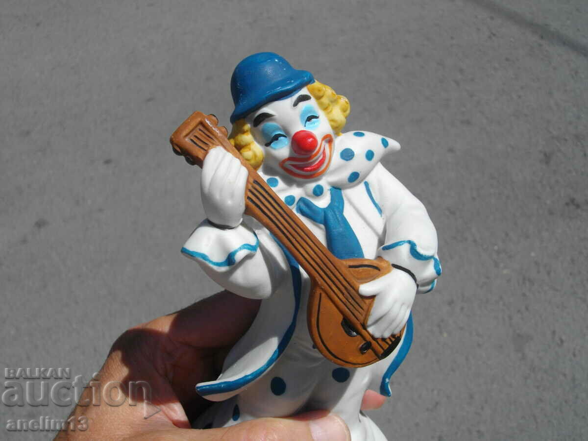 Auction OLD PORCELAIN FIGURE WITH LANTERN PORCELAIN CLOWN Auction OLD PORCELAIN FIGURE WITH LANTERN PORCELAIN CLOWN