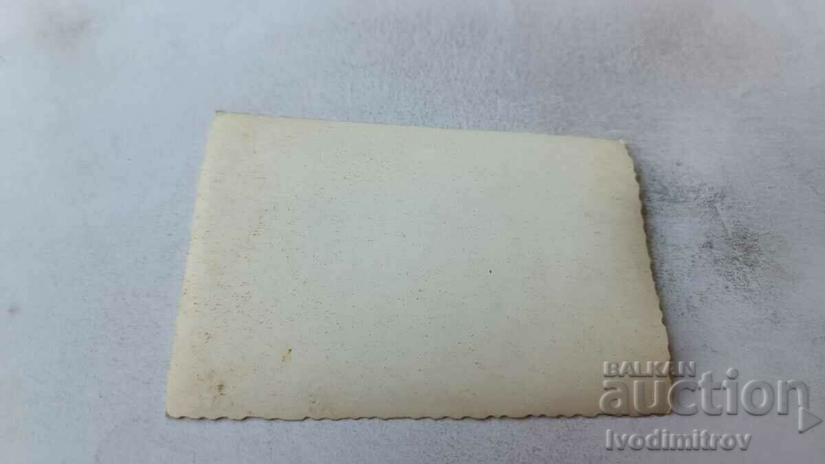 Photo Four young men with a boat in the sea with price 2.35 BGN | € 1.20