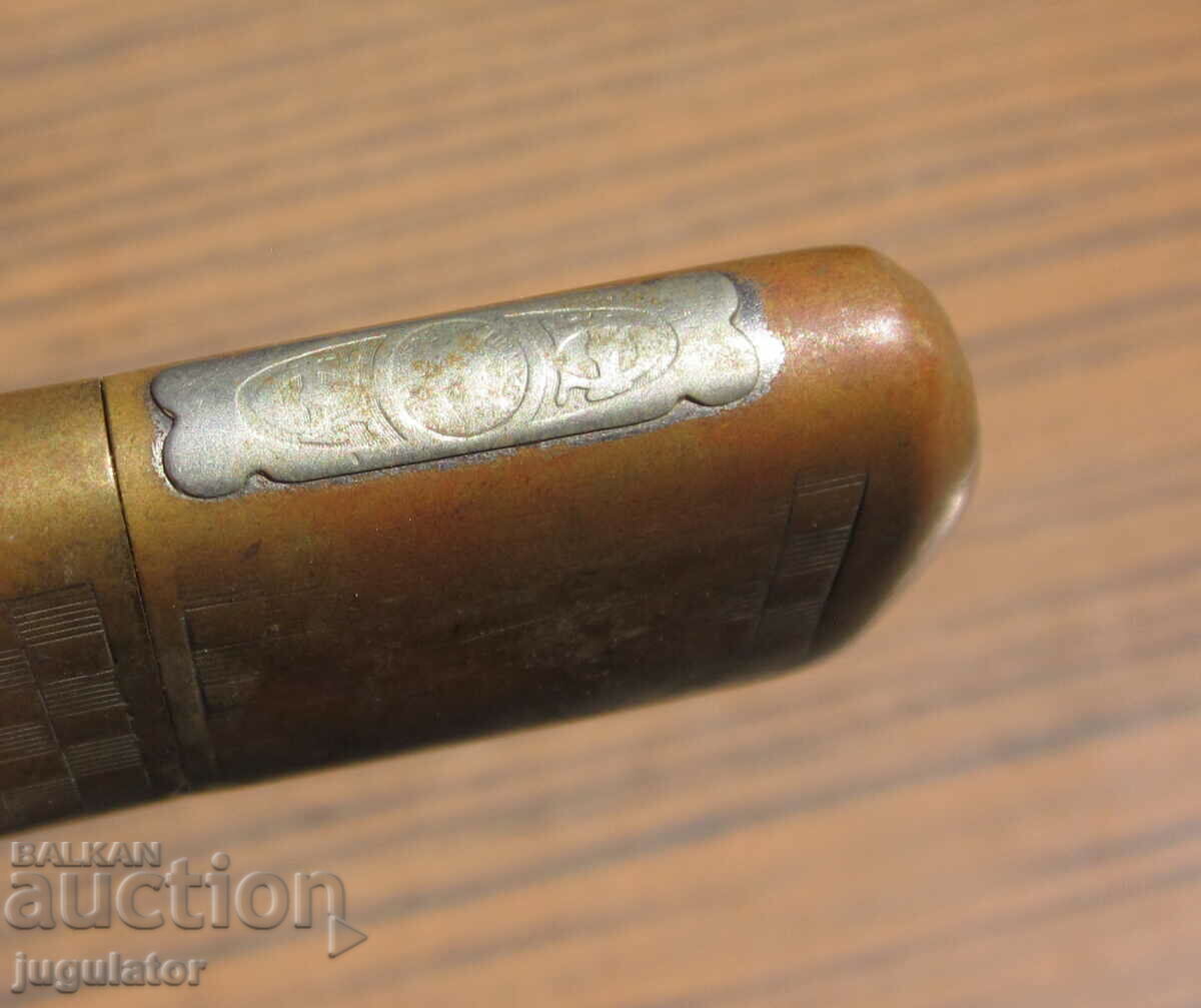 Auction  antique bronze working petrol lighter from the 1930s