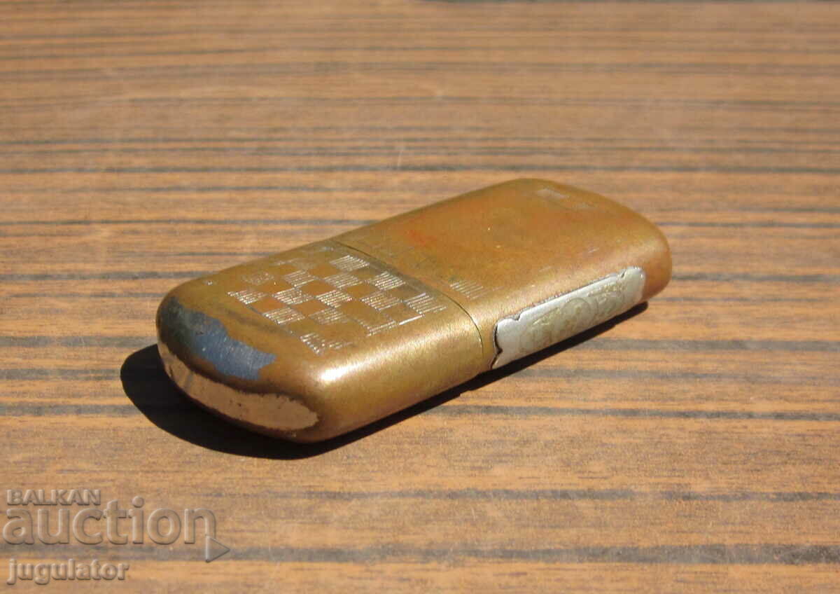 Delivery of antique bronze working petrol lighter from the 1930s