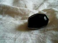an old ring with a large natural black stone