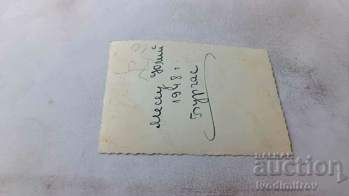 Photo Burgas A young woman in a swimsuit sitting on a railing, 1948 with price 2.75 BGN | € 1.41 Photo Burgas A young woman in a swimsuit sitting on a railing, 1948 with price 2.75 BGN | € 1.41