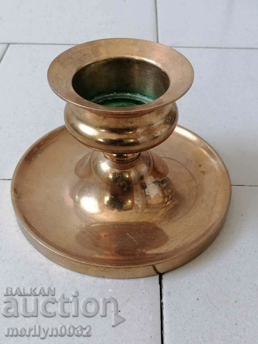 Old bronze candlestick, candle
