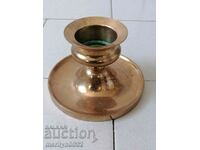 Old bronze candlestick, candle