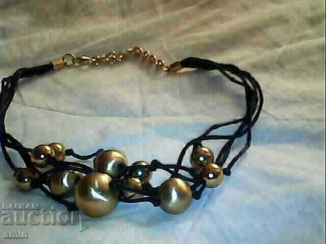 Delivery of beautiful necklace with gold-plated balls Delivery of beautiful necklace with gold-plated balls