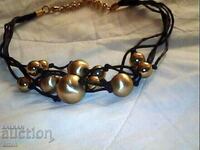beautiful necklace with gold-plated balls