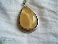 old beautiful necklace with a huge natural stone