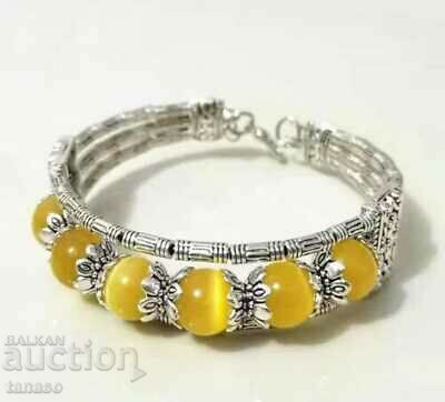 A beautiful women's bracelet in Tibetan silver with yellow opals