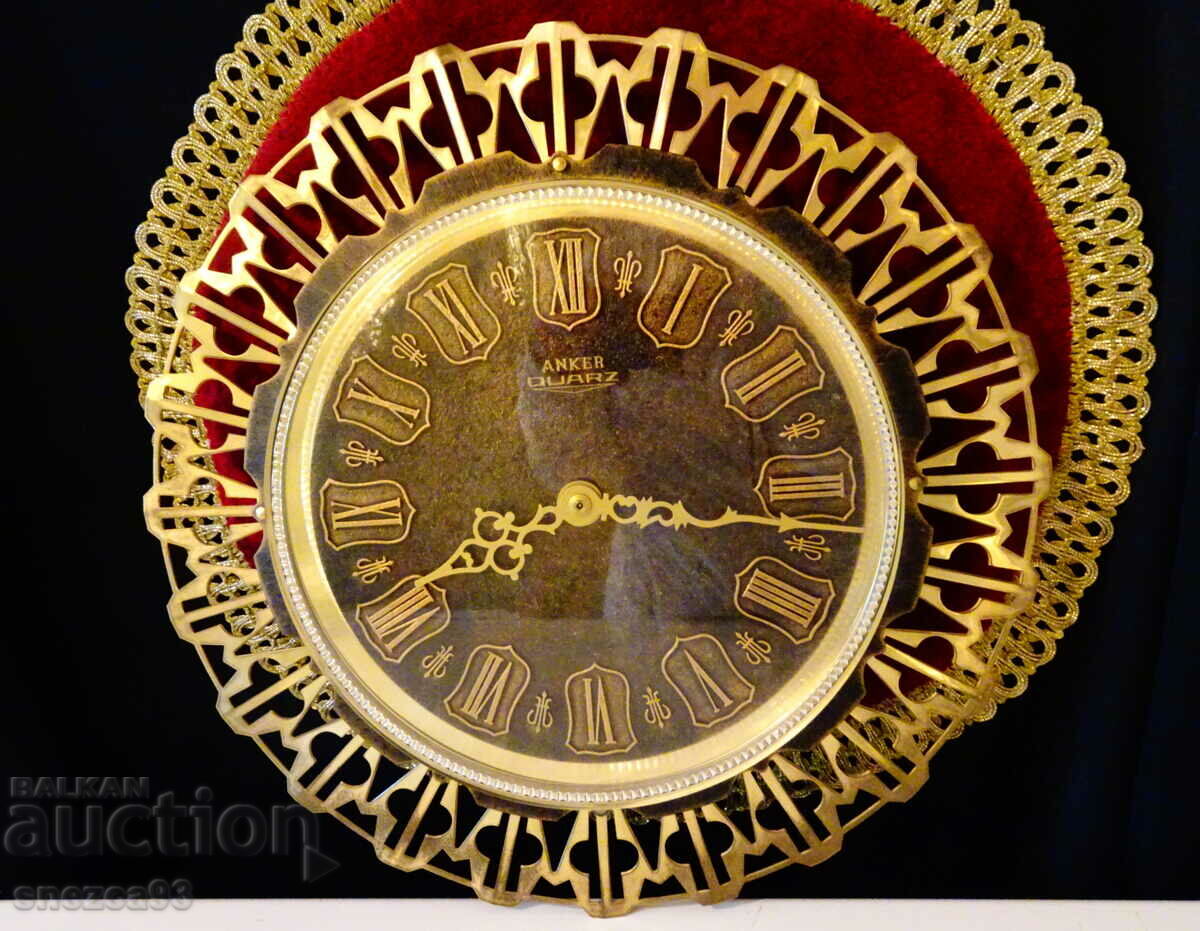 Anker wall clock, gold-plated brass.