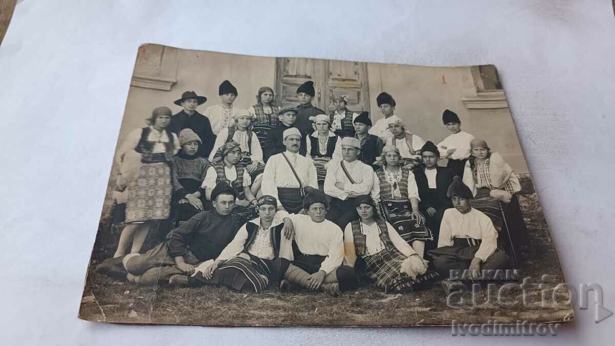 Photo Pupils with their teacher in folk costumes
