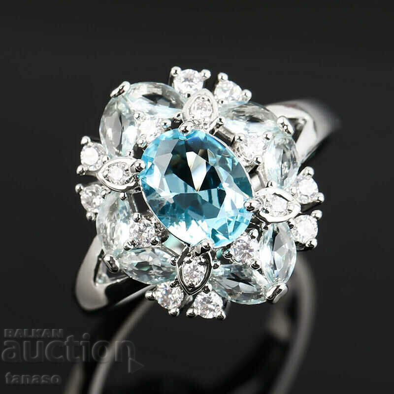 Auction Ring with aquamarine and zircons Auction Ring with aquamarine and zircons