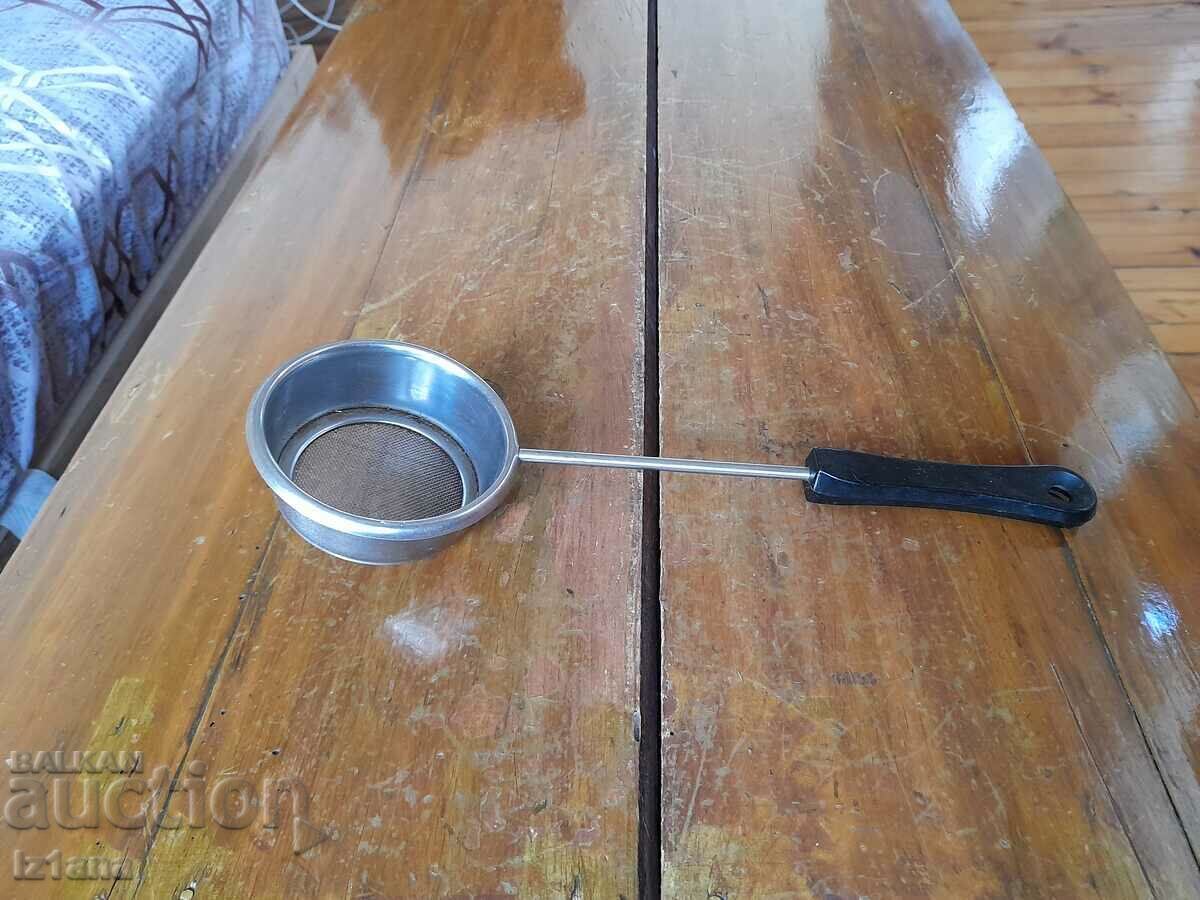 An old kitchen strainer An old kitchen strainer